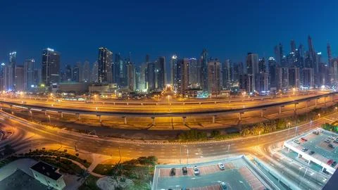 Panoraama of Dubai Marina skyscrapers and Sheikh Zayed road with metro railwa Stock Photos