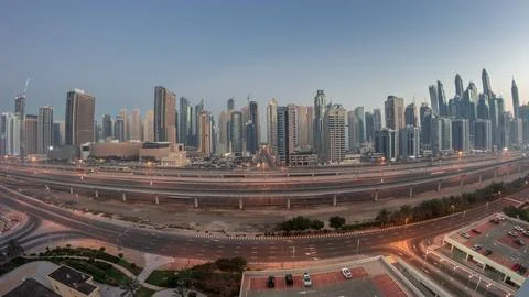 Panoraama of Dubai Marina skyscrapers and Sheikh Zayed road with metro railwa Stock Photos