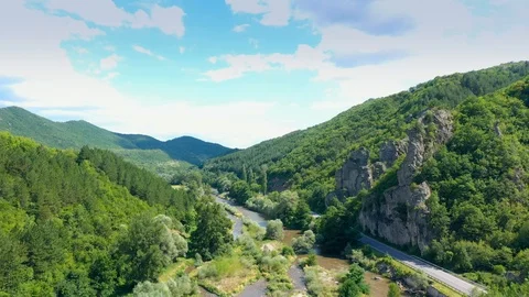 Panorama aerial view on road in between the mountains and river. Stock Footage 114480394