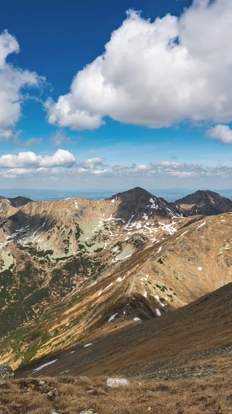 Panorama of Alps Mountains with Fast Clouds on Blue Sky in Sunny Spring Vertical Video stock 310809743