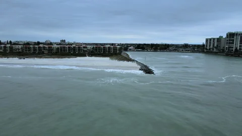 Panorama of Beach Breaker Rocks With Waves Cresting Along Shoreline Stock Footage 203795512