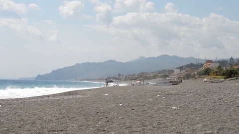 Panorama of the beach with clouds and rough sea Video stock 121090804