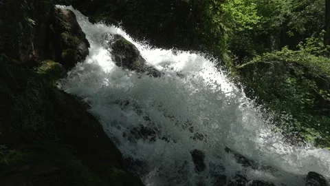 Panorama from beautiful waterfall in the forest to the river. Strong stream of Stock Footage 134697518