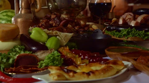 Panorama beautifully set table with dishes of the peoples of the world Видео 58032148