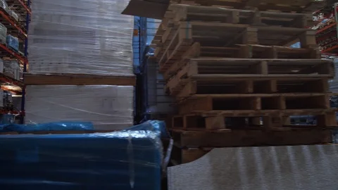 Panorama between the rows of a huge logistics warehouse. 4K Slow Mo Stock-Footage 111766703