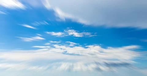 Panorama of blue sky with white clouds in clear weather Stock Photos