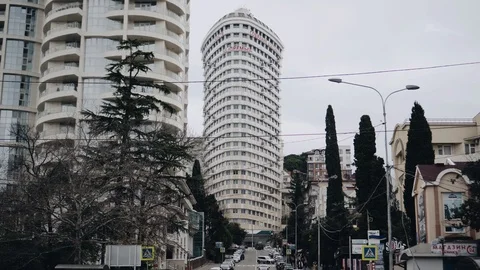 Panorama from the bottom up on a busy intersection in the resort city Stock Footage 122435696