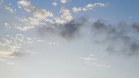 Panorama of the Bright Sky. Dark Cloud Against White and Colorful Clouds. Stock Footage 220664600