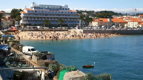 Panorama of Cascais Bay including crowded sandy Praia do Ribeiro on a sunny Stock Footage 112791333