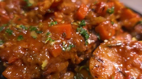 Panorama close-up of a gourmet braised Osso Buco steak Stock Footage 312470985
