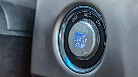 Panorama Close up view of an engine push start and stop button inside a vehicle Stockfoto's