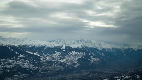 Panorama of clouds moving across sky above Swiss mountains close to Engelberg Stock Footage 129100147