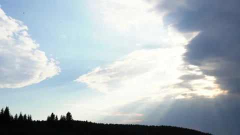 Panorama of cloudy sky with sun and shadow of forest. Media. Overcast clouds Stock Footage 231164092