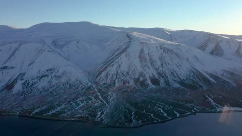 Panorama of coastal mountains of Chukotski peninsula covered with snow. Stock Footage 165526341