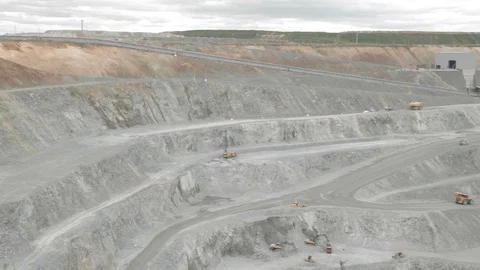 Panorama of the copper open pit (trucks and rigs) Stock Footage 83413605