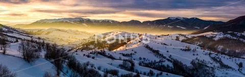 Panorama of countryside at sunrise in winter Stock Photos
