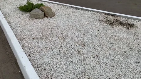 Panorama of decorative stone lawn close-up on a cloudy day Stock Footage 159729460