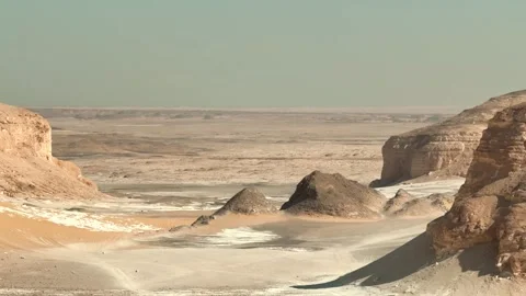 Panorama of desert valley with limestone wind shaped rocks and sand around Stock-Footage 340869954
