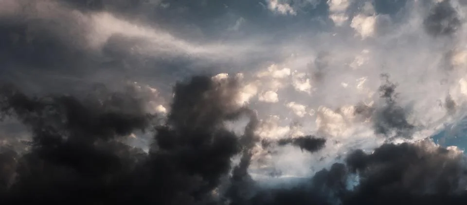Panorama of dramatic cloudy overcast sky Stock Photos