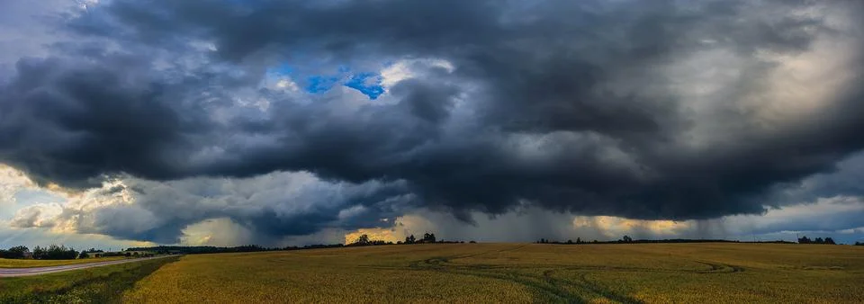 Panorama of dramatic storm clouds in the sky, dark severe storm clouds Stock Photos