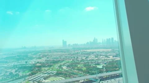 Panorama of Dubai from a high glazed tower. Sunny cloudy day Stock Footage 278858926