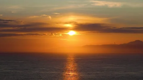 Panorama of a Fantastic Sunset at the Sea. The Sun Touches the Horizon.  Stock Footage 245154553