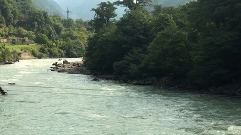 Panorama of a fast mountain river flowing among mountains Stock Footage 126318598