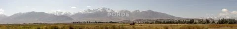 Panorama of fields in Kochkor Village, Kyrgyzstan Stock Photos