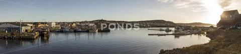 Panorama of fishing boats and fishermen in Bonavista harbor, Newfoundland, C Stock Photos