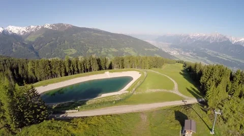 Panorama Flight over a Mountain Lake - Aerial Flight Stock Footage 40707369