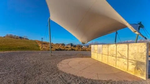 Panorama frame Concrete rectangular structure on a rocky ground under a white Stock Photos