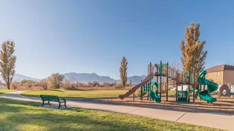 Panorama frame Paved pathway through a neat urban park Stock Photos