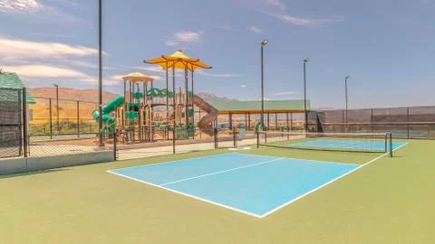 Panorama frame Two empty outdoor pickleball courts on sunny day Foto stock