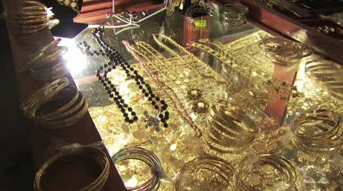 Panorama Of Gold Bracelets and Chains In A Glass Case Video stock 19184758
