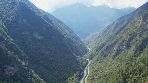 Panorama of the gorge between three mountains covered with forest, a mountain 库存影片 256167542