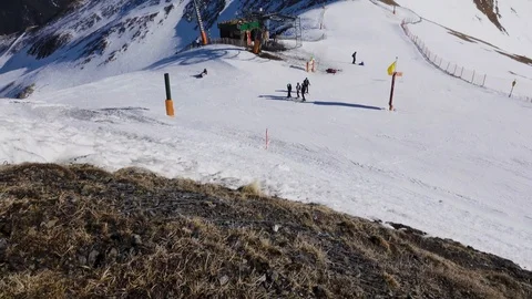 Panorama horizontal. Many people start skiing on a well-groomed ski slope at a Stock Footage 109528254