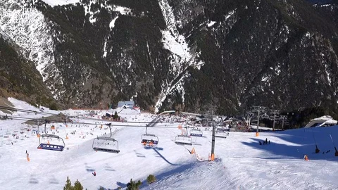 Panorama horizontal. Many people start skiing on a well-groomed ski slope at a Stock Footage 109528344