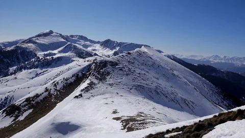 Panorama horizontal. Many people start skiing on a well-groomed ski slope at a Stock Footage 109528458