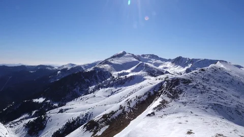 Panorama horizontal. Many people start skiing on a well-groomed ski slope at a Stock Footage 109528513