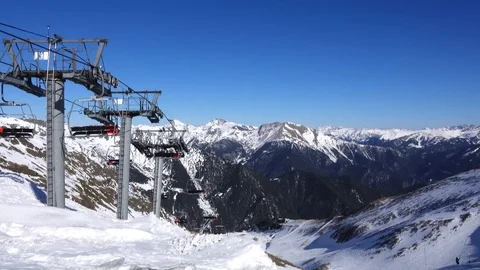 Panorama horizontal. Many people start skiing on a well-groomed ski slope at a Stock Footage 109528763