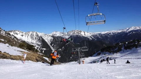 Panorama horizontal. Many people start skiing on a well-groomed ski slope at a Stock Footage 109528795