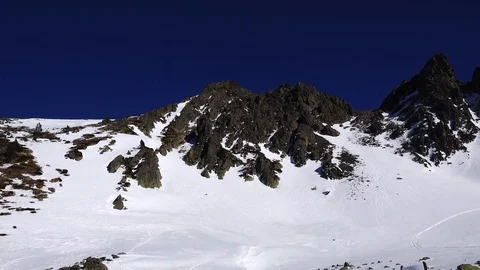 Panorama horizontal. Many people start skiing on a well-groomed ski slope at a Stock Footage 109529393