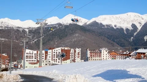 Panorama of hotel complex and ski lifts on a sunny day 스톡 동영상 84734061