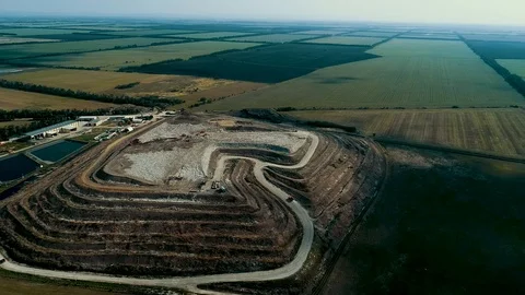 Panorama of a huge garbage dump. Seagulls circling over the garbage. Stored Stock Footage 114472644