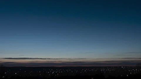 Panorama hyperlapse of the golden hour of sunset. The image shows the lights of Stock Footage 253996299