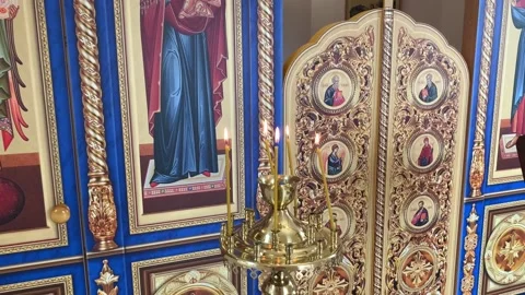 Panorama of the interior decoration of the chapel close-up, icons and candles Stock Footage 159729439