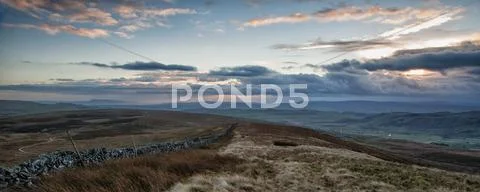 Panorama landscape sweeping countryside view at sunset in autumn Stock Photos