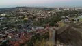 Panorama of large city in dusk light, mountains on horizon, beautiful cityscape 4k or 4k+ Resolution