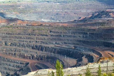 Panorama of large operating mine. Extraction of natural resources. Stock Photos