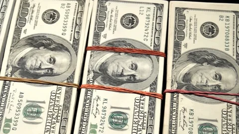 Panorama left to right hundred dollar bills in slow motion. Stock Footage 129786580